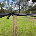 MAC 1014 on a fence post.