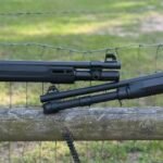 Beretta A300 Ultima Patrol and MAC 1014 shotguns displayed side by side on a wooden fence outdoors.
