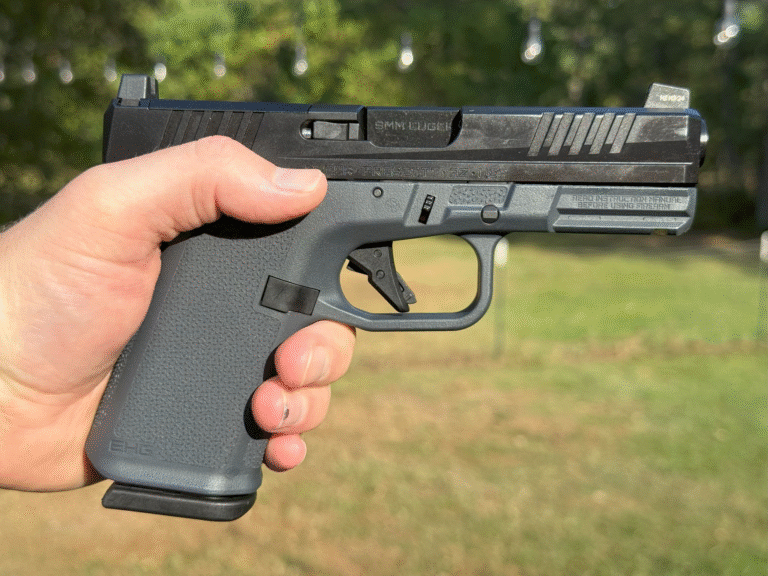 Ruger RXM 9mm pistol with Magpul EHG grip and optics-ready slide.