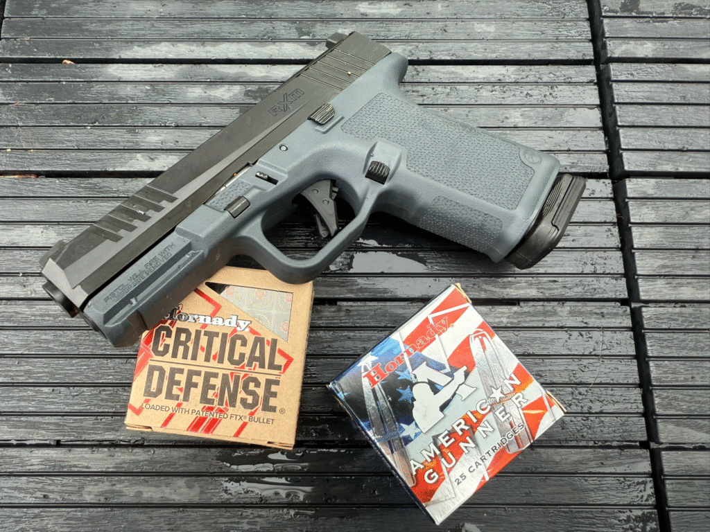 Ruger RXM Glock 19 clone 9mm pistol displayed with Hornady Critical Defense and Hornady American Gunner ammunition.