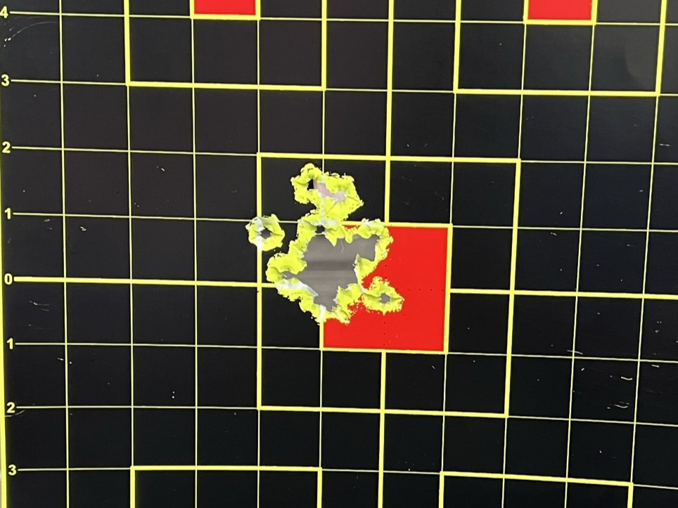 Target with a very tight bullet grouping.