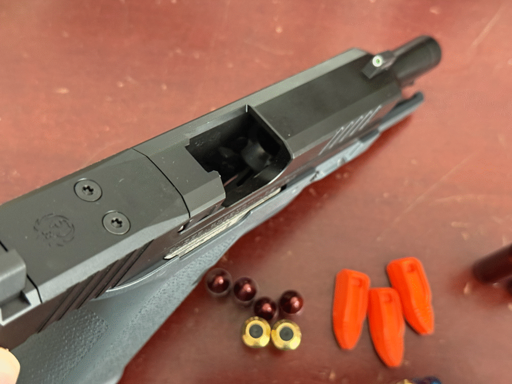 A photo of a Ruger RXM pistol demonstrating it is clear and safe.