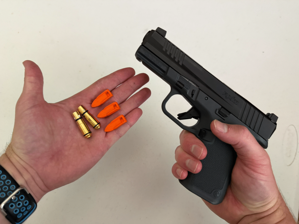 Ruger RXM with a laser trainer cartridge.