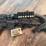 Home defense firearms including a Beretta A300 Ultima Patrol shotgun, AR-15 rifle, and Ruger RXM handgun