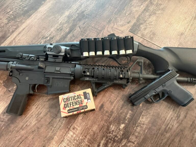 Home defense firearms including a Beretta A300 Ultima Patrol shotgun, AR-15 rifle, and Ruger RXM handgun