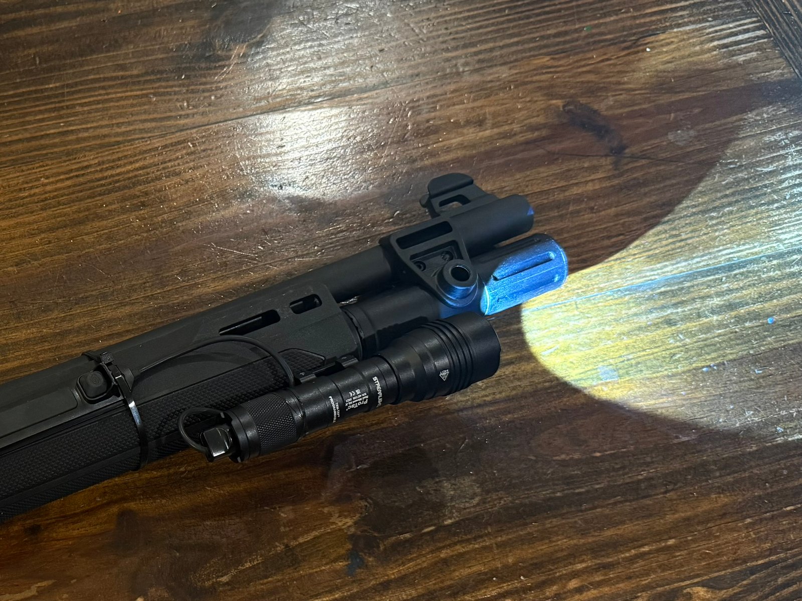 Using light in home defense shown with a shotgun-mounted weapon light providing illumination for positive identification indoors