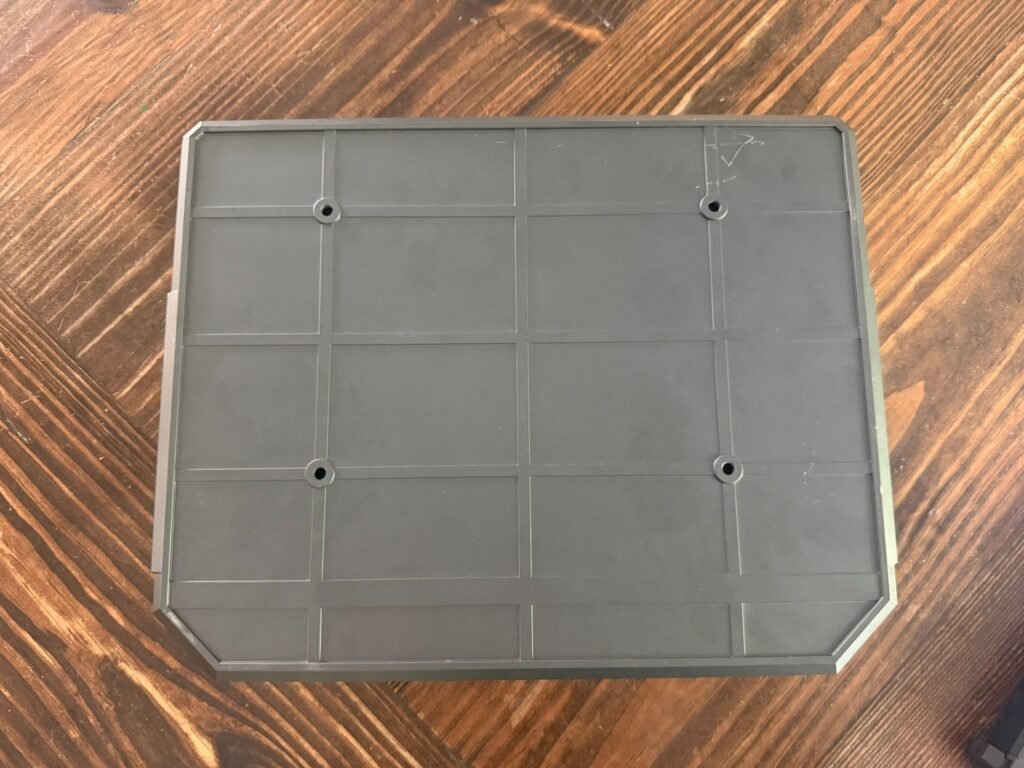 Underside of XEGIS palm vein biometric handgun safe with pre-drilled mounting holes for secure installation.