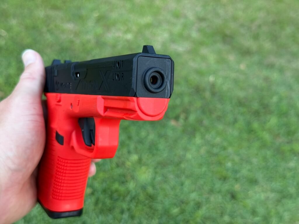 Mantis TitanX laser training pistol front view showing laser emitter and barrel area used for dry fire training