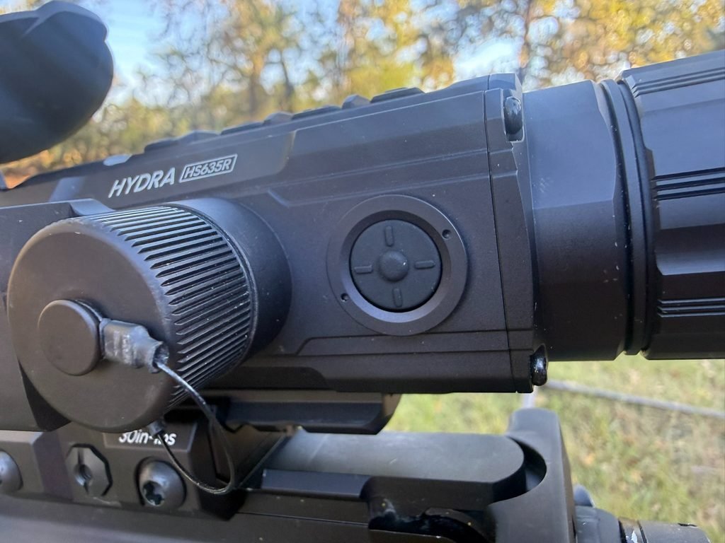 Close-up of the integrated laser rangefinder on the DNT Hydra HS635R thermal scope