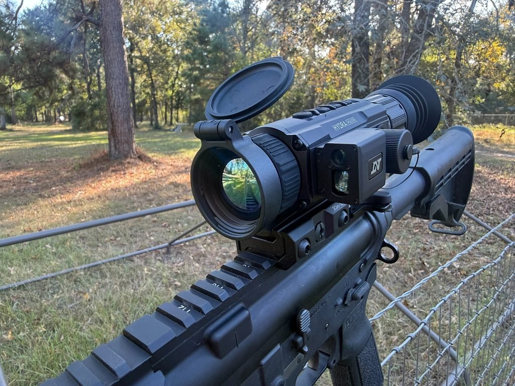 Front view of the DNT Hydra HS635R thermal scope showing the objective lens and integrated laser rangefinder